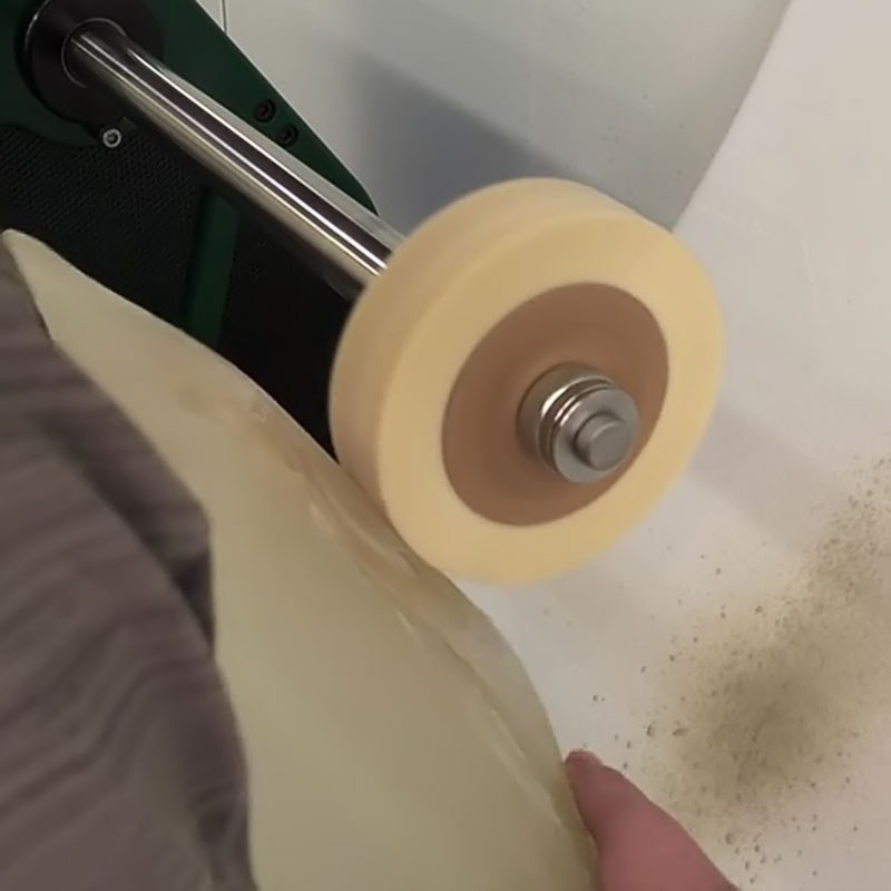 grinding glass with pumice on a brush wheel
