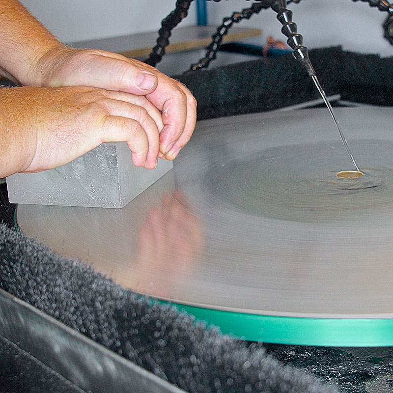 Grinding a glass surface with an electroplated diamond disk